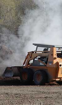 Working the bark pile on a cool morning